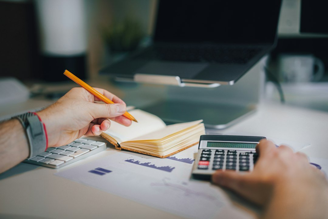Financial planning with calculator and currency